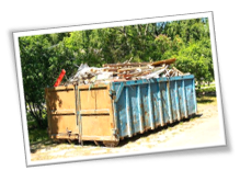 trash Large dumpster filled with construction debris outdoors.