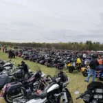 Large motorcycle gathering in outdoor field event