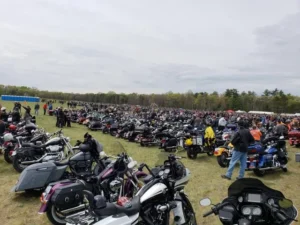 Large motorcycle gathering in outdoor field event