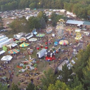 Aerial view of colorful amusement park and rides.